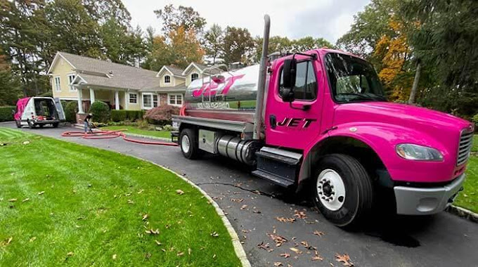 A truck of Jet Cesspool Service going to a client who needs hydro jetting drain cleaning.