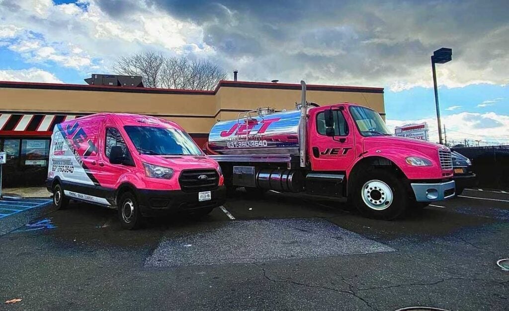 JET Cesspool Service pink pump truck and service van